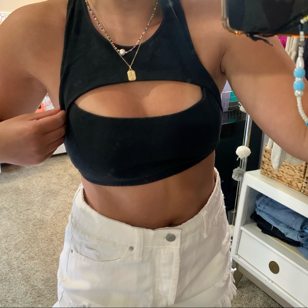 Out from under bra top!